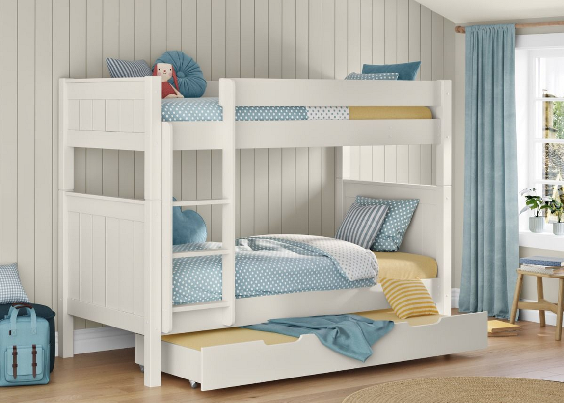 Detachable wooden bunk bed in white with a trundle bed that pull out from under the bed for sleepovers